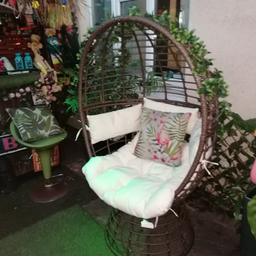 Large swivel egg chair with cream cushions. Can deliver local for fuel.