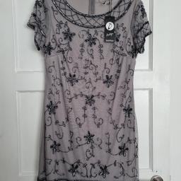 New dress from Boohoo, size 10.
Grey/mauve coloured material.
Collection Wombourne WV5.