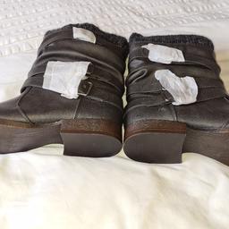 Ladies Ankle Boots Strap And Buckles. Brand New uk5. See photos for condition size flaws materials etc. I can offer try before you buy option if you are local but if viewing on an auction site viewing STRICTLY prior to end of auction.  If you bid and win it's yours. Cash on collection or post at extra cost which is £4.55 Royal Mail 2nd class. I can offer free local delivery within five miles of my postcode which is LS104NF. Listed on five other sites so it may end abruptly. Don't be disappointed. Any questions please ask and I will answer asap.
Please check out my other items. I have hundreds of items for sale including bikes, men's, womens, and children's clothes. Trainers of all brands. Boots of all brands. Sandals of all brands. 
There are over 50 bikes available and I sell on multiple sites so search bikes in Middleton west Yorkshire.