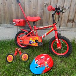 Kids bike with 4 wheels, additionally a bicycle push bar and a children's helmet. All complete