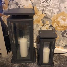 Candle lanterns inc candles 
A pair