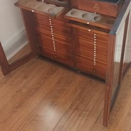 Old walnut coin cabinet with lockable glass doors very good condition for the age of it . A nice peace of furniture
