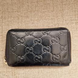 Men's black leather gucci wallet. 3 compartments, genuine gucci with serial number inside the wallet. Visible Wear and tear from everyday use