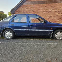 FORD ESCORT 5 DOORS 1600 CC 1994 BLUE PETROL 29 YEARS OLD BODY WORK IS FAIR NEED REAR ARCHES ATTENTION WILL SUIT SOMEONE WITH SPARE TIME
 MECHANICAL GOOD BEEN STANDING OVER LOCK DOWN PLEASE STUDY PHOTOS please make sense able offer with service history drive very good 
