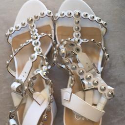 Mode in Pelle stunning white & silver sandals worn once. Tiny mark on heel as in photo but like new . Grab a bargain