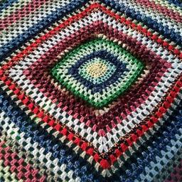 Hand knitted woollen square blanket/ shawl when winters chill drifts in. 

Gorgeous vibrant colours.

Size 1.0 X 1.2mtr
