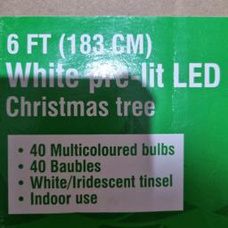 6 ft (183 cm) white pre-lit LED pop up Christmas tree for indoor use. Baubles included but may or may not be 40 as stated as not counted. In good condition. Used only once. Not keen on white trees, so selling. £42 on Amazon.