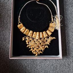 brand new gold necklace. beautiful intricate detail with sparkly silver stones.
Cost alot more but is an unwanted gift.
