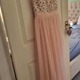 Selling this beautiful dress!! 

Only just brought it but its too small.

Size says a 10 but it's more of an 8 on top.

Lovely pink, sequined dress, stretchy back panel, long floor length gown, slit to one side, beautifully lined.

Looking for JUST £15. Happy to post.