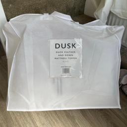 Brand new king size duck feather mattress topper. It is brand new. RRP IS £90 on dusk.com