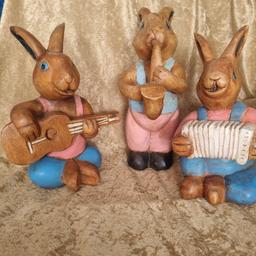 Unusual but a have a real charm to them. Ideal for a garden maybe..the rabbit holding the saxophone is 28cm tall and the other 2 are 23cm (accordion) and the guitar playing 25cm tall. If you'd like any more photos just message me and I will take some more.