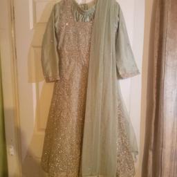 Asain mint girls wedding party wear dress with gold embroidery. Size 34. Been worn once for couple of hours. In very good condition.

All offers considered