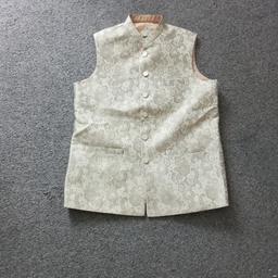Mens asain waistcoat.  Size Medium. Cream goldy colour. Been worn once for few hours. In very good condition like new

All offers considered