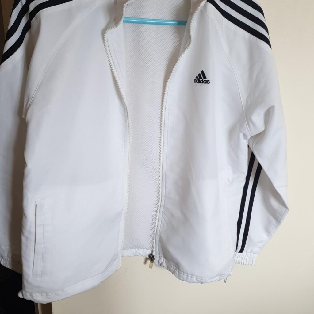 Beautiful boys Adidas sweat shirt. Size 30/32 Can fit to 12/13 years old. It got net it laning in said. zip and 2 pockets on the side with zip. Hardly worn. very good condition. from smoke and pets free home. local delivery available with small amount of charge.