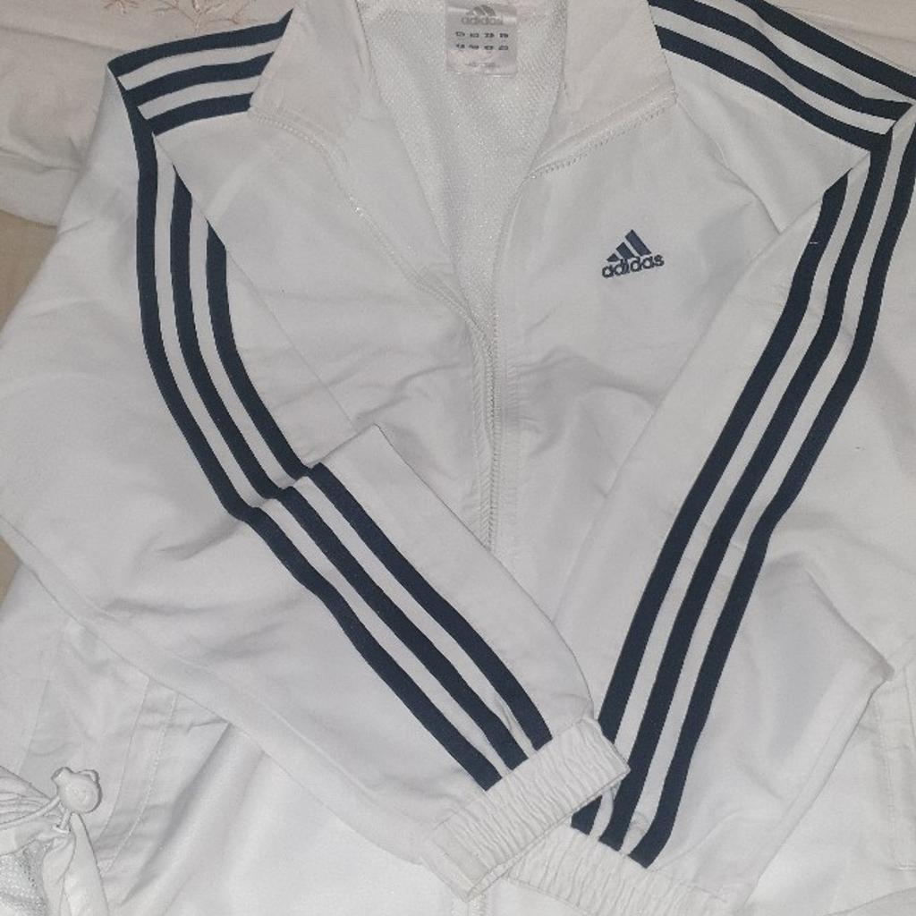 Beautiful boys Adidas sweat shirt. Size 30/32 Can fit to 12/13 years old. It got net it laning in said. zip and 2 pockets on the side with zip. Hardly worn. very good condition. from smoke and pets free home. local delivery available with small amount of charge.