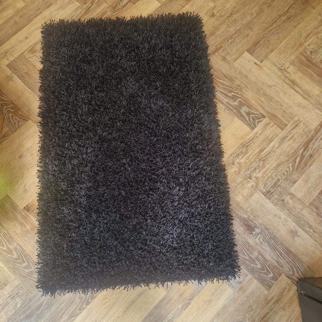 Black rug 3ft x5ft long very very good condition, has been stored away in a spare room