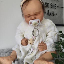 Welcome to my listing for this beautiful reborn baby doll.  She has been painted using heat set paints and finished off with matte varnish.  Beautiful knitted cardigan. 
She has beautiful handpainted veins and mottling, brown rooted hair and eyelashes. 
will come well wrapped for delivery.
No suitable for young children