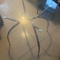 Round glass dinning room table fits four chairs round it in really good condition.