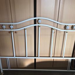 White metal headboard, king size with flower detail. Good condition.