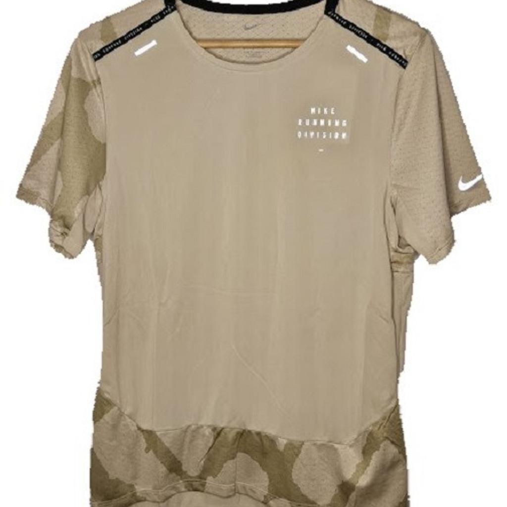 Nike Dri-FIT Run Division Rise 365 T-Shirt.

Size: XL

Colour: Camouflage Sand/Beige

Lightweight and breathable, the Nike Dri-FIT Run Division Top is geared to make those tough runs a little easier. It keep you covered and feeling smooth, making it ideal to wear before, during or after your run. Suit up and feel the difference.

Quick Drying, Breathable Feel

Nike Dri-FIT technology moves sweat away from your skin for quicker evaporation, helping you stay dry and comfortable. It is combined with textured mesh for optimal breathability.

More Benefits:

 The back hem is extended for extra coverage.
 93% polyester/7% elastane
 Machine washable
 An underarm gusset helps you move freely.
 Style: DQ4757-206
 RRP: £45.00