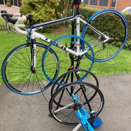 mens road bike also turbo trainer spare wheel and tyres and maintenance stand.