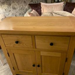 Beautiful solid oak sideboard with two drawers with dovetail joints for superior strength and quality, large cupboard underneath with useful shelving, good quality pice of furniture perfect for any room, measurements are 85 cm width, depth 38cm , height 85 cm