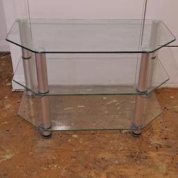 Clear Glass TV Stand with two shelves. Silver legs 
height 19 1/2 inches
width 32 inches
depth 18 inches
payment on Collection only.
Catford Centre Area