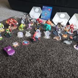 big bundle of Disney Infinity characters, mini games, and discs, game included, played with PS4. 3 bases also included. 70 pieces