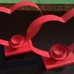 IKEA: Heart Tealight holder (red). Metal structure.

A pair so can be used together, on bed side tables, or a romantic meal. Simple design, so would lend to most home themes or cafe.

H21W21D7cm