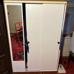 3 door wardrobe, 2 sliding , 1 fixed , hanging rail , white front , teak sides , mirror , solid and strong , good condition sizes in cm w 114 , d 54 , h 168 , can be delivered locally to Blackburn for a charge , 07784859403