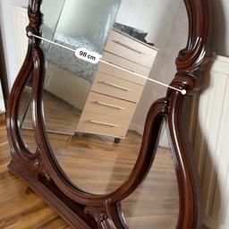 Vintage mahogany mirror, perfect for bedroom or home wall hanging. Solid wooden frame shaped and carved out. Can be hung or led to a drawer to support that vintage theme. A must see piece!