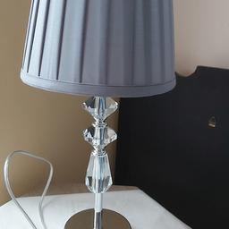 It is in like new condition, i just opened the packaging to test it, it works and looks perfect,this table lamp comes in metal and glass finish complete with grey fabric lampshade, it has modern and beautiful look,lampshade size is 20cm wide x 18cm in high, table lamp full height is 46 cm, it is for collection from Little lever, bolton or if you buy afew more items from my list, I can drop it on free of charge to 5miles radius from me, please see my other items, thank you