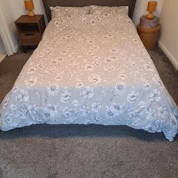 Very stylish double ottoman gas lift bed opens from bottom and is very sturdy plenty of storage underneath in grey with darker grey trim and buttons no mattress included. Only reason for sale is going for a murphy wall bed for more space. Feel free to ask any questions or offers.