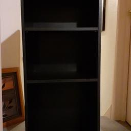 Tall black wood grained storage/display unit. Shelves can be mounted at different levels. Ideal for Lounge, bedroom or dining room areas. 41 inches tall x 16 inches wide and 14 inches deep. No marks or scratches. Excellent quality and condition. Very sturdy and heavy. reduced price so no silly offers please