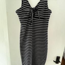 Navy-white stretchy striped sundress. Skinny fit. V front & back. Tie front. Knee length. 95% cotton 5% elastane. Excellent condition. Collection from Warton B79 or post at extra cost.