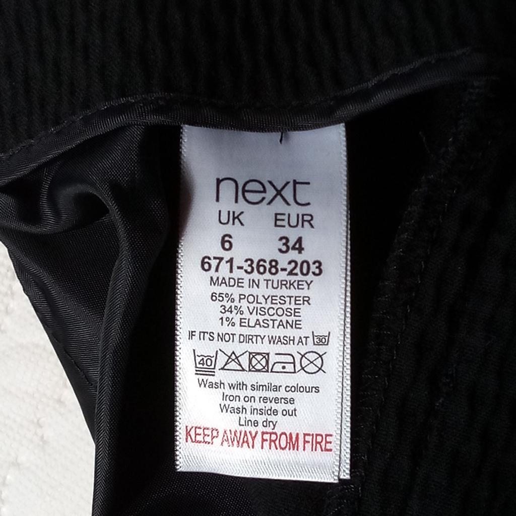 Black formal pants from Next 6
The colour is black as took the photos in the sunshine, so I don't have a posh phone so doesn't adjust, but mention this here so you are aware. Lovely textured material that stretches to fit.

Clearing wardrobe out due to having baby.

Local collection preferred from a safe spot, Tesco Express Tulketh Mill PR2 2BT. Protects both seller & buyer.

### For sent items-Any PayPal payments; buyer pays all fees or FULL payment sent as only fair.

I don't do bank transfers or Western Union.

Humblest of apologies.