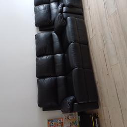 2 x black faux leather recliner sofas. In good condition with small scuffs as seen in the picture. recliners work perfectly as seen £30 each