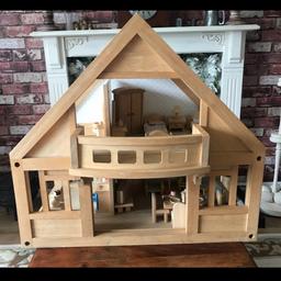 Dolls house with sliding doors & removable balcony Good clean condition 
All furniture has working doors & draws