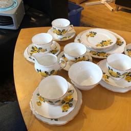 Lovely tea set from Royal Vale bone china. No chips or cracks. 6 tea cups. 6 saucers.  6 side plates. Sugar bowl. Milk/cream jug and 1 x larger plate. White china with yellow roses and gold trim