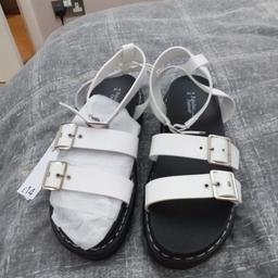AS ABOVE LADIES SIZE 6 WHITE BUCKLED FLATFORM SANDALS. ADJUSTABLE STRAPS X2 TO FRONT ADJUSTABLE STRAP TO ANKLES THESE COME UP A BIT HIGHER THEN THE ANKLE..THESE ARE BRAND NEW WITH LABELS STILL ATTACHED & IN PACKAGING THESE ARE CASH ON COLLECTION ONLY I DONT WONT POST COLLECTION MANSFIELD WILL NOT SAVE NO OFFERS