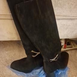 Black suede boots, real suede from Clarks shoe shop. Thick high heel 3 inchs approx. In good condition, only worn a few times and size 39/6 UK. 
Collection Preferred but can be posted.