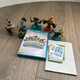 Wii U Skylanders Swap Force game for sale. Includes 6 figures, stickers, cards and poster. In good condition.