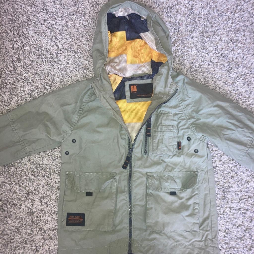 Next light khaki coloured jacket with hood. Excellent condition from a smoke and pet free home.