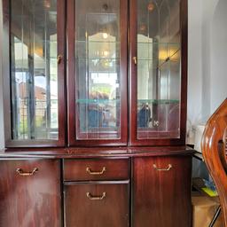 display cabinet. lights up inside. has scratches on bottom half. Good condition other than that