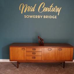 Mid Century Sowerby Bridge

William Lawrence Teak Sideboard
2 Door 1 Drop down and 3 drawers
Dimensions L199cm D48cm H79cm

Collection from Mid Century Town Hall Street Sowerby Bridge, We are happy to liaise with couriers and would recommend Anyvan Or Shiply for quotations.

Please message me to arrange viewings,
and check out my other items available.

Items may show signs of wear and imperfections due to age.