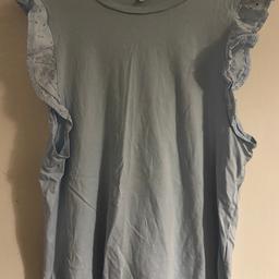 Lady’s pale blue vest top with frill sleeves £1.00
Size 16
In good condition 
Collection Hounslow Heath