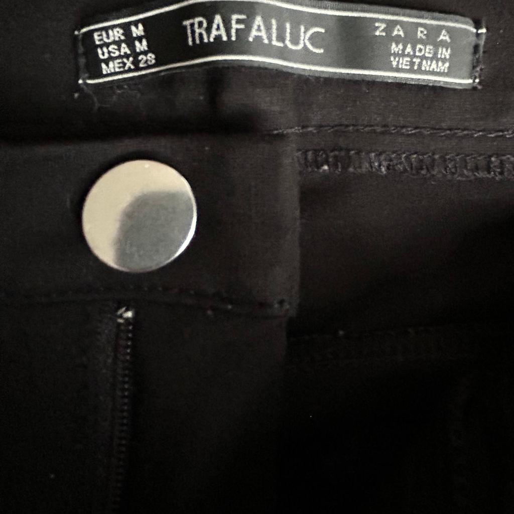 Zara Trafaluc black jegging type trousers. Stretchy. False pocket detail to rear and front but front have zip details. Also zip fitting to inside ankle. Size EUR M, USA M, MEX 28. Only worn a few times