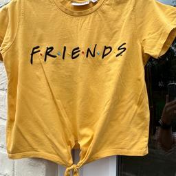 Mustard yellow T-shirt with Friends logo and tie detail