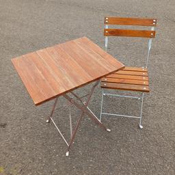 SMALL TABLE AND CHAIR , IDEAL BALCONY / SMALL SPACES ETC. METAL AND WOOD FOLDS UP FOR STORAGE. TOP IS 23 X 19 "