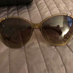 Beautiful Michael Kors sunglasses, with leather on the corners, arms have a bit of wear and tear otherwise in great condition